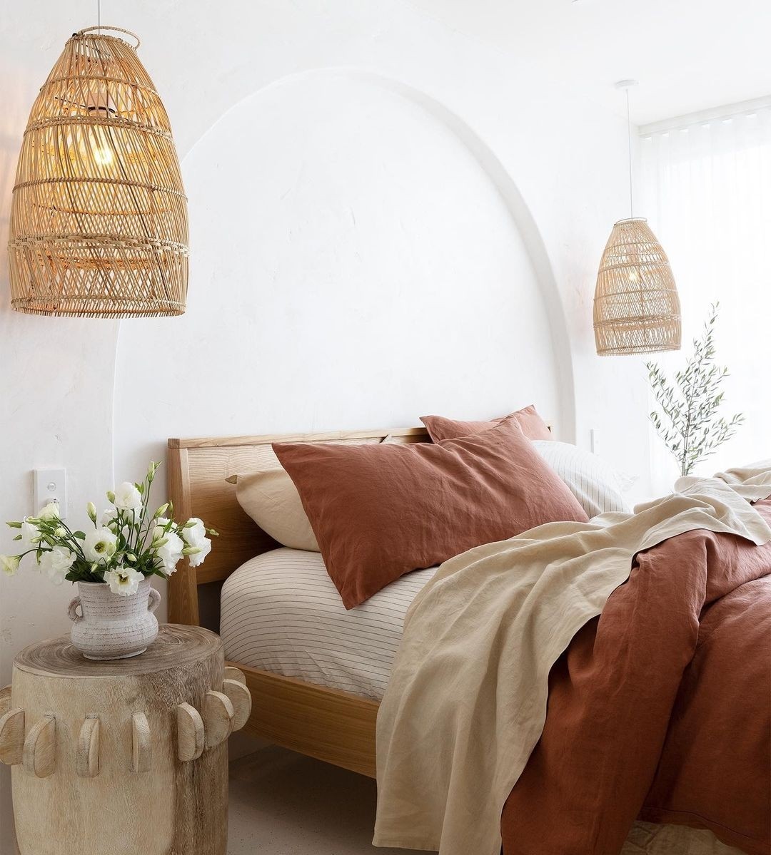 I love linen bedroom with rattan pendant lights