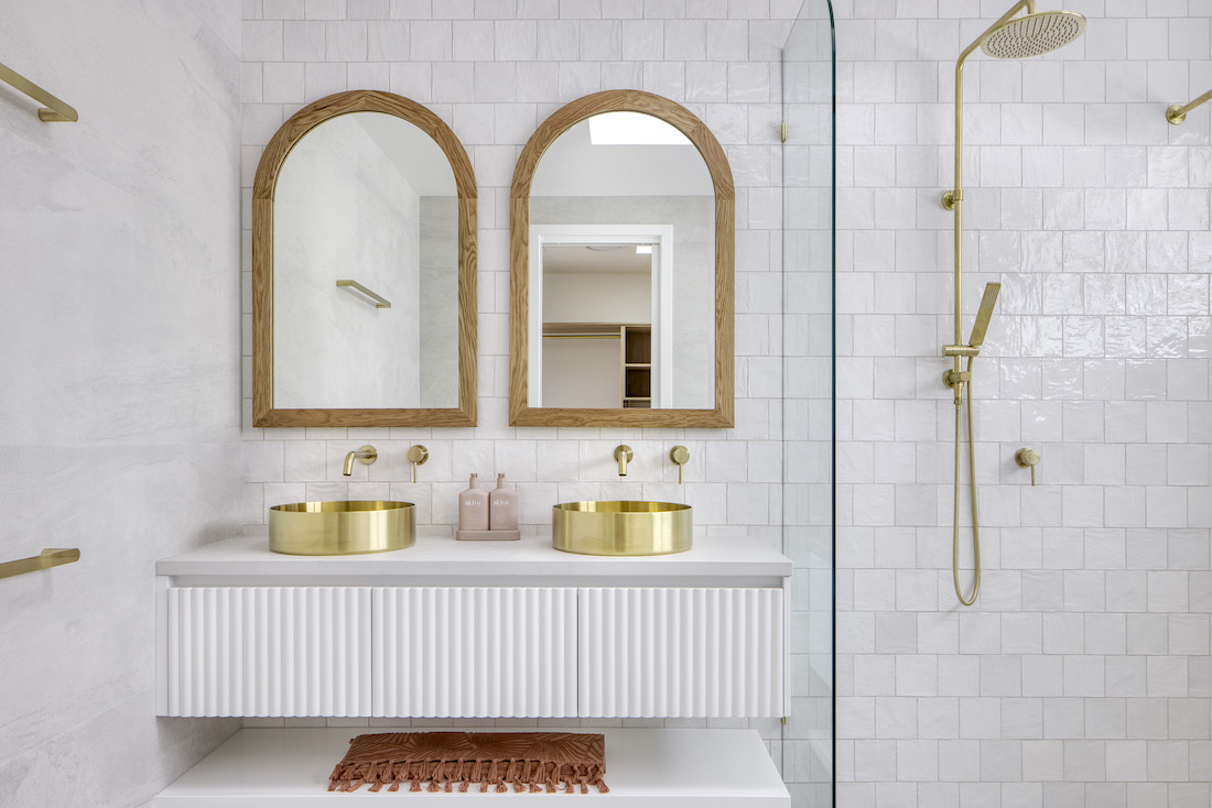 Tawarri house bathroom with two arch mirrors