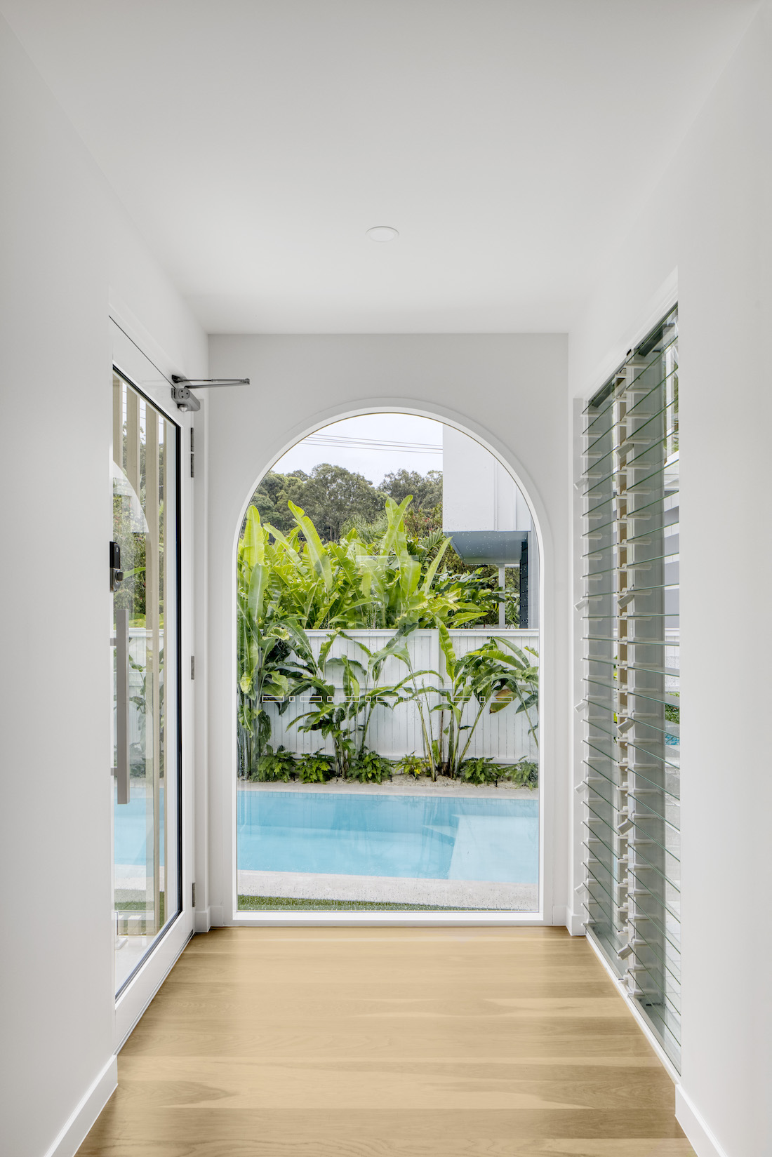 Arch doorway with view to pool at Tawarri house
