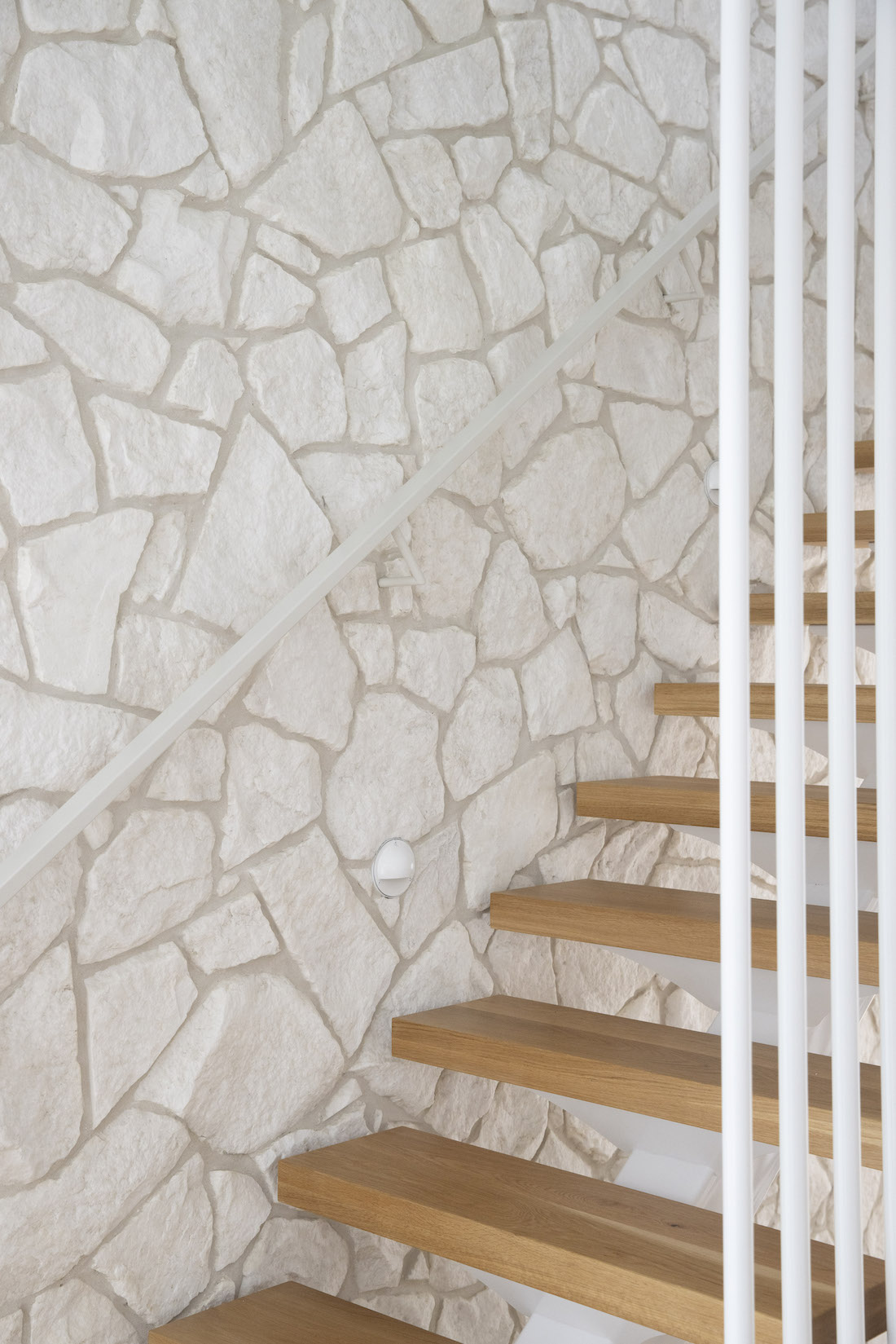 Staircase crazy pave stone feature wall at Tawarri house