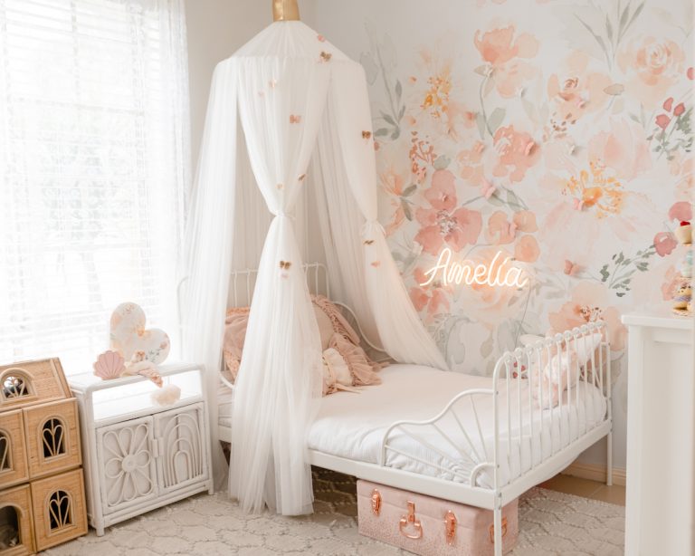 Dreamy pink girl’s bedroom: Take a tour of Amelia’s big girl room revamp with floral pink wallpaper and neon light