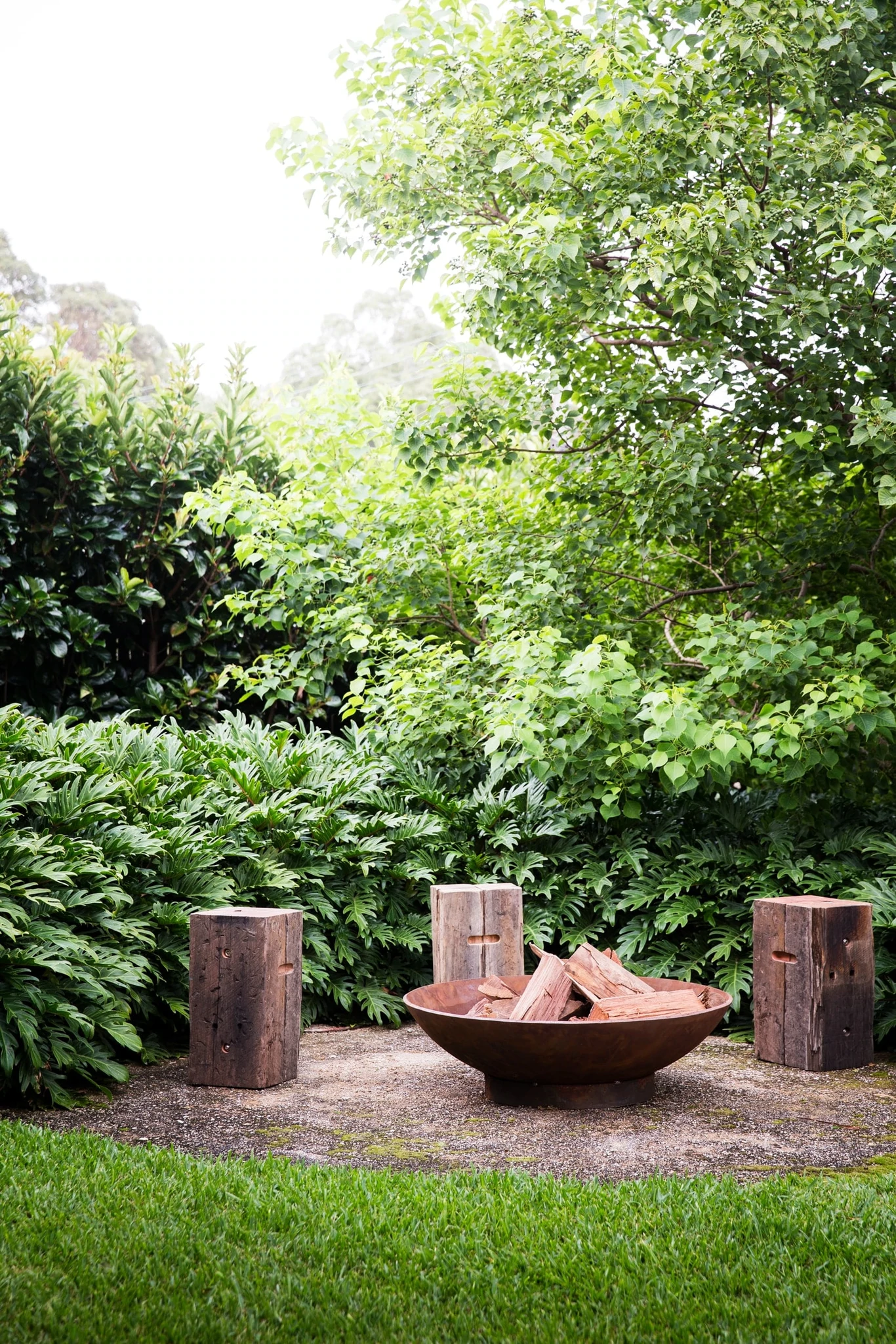 Lush garden with fire bowl