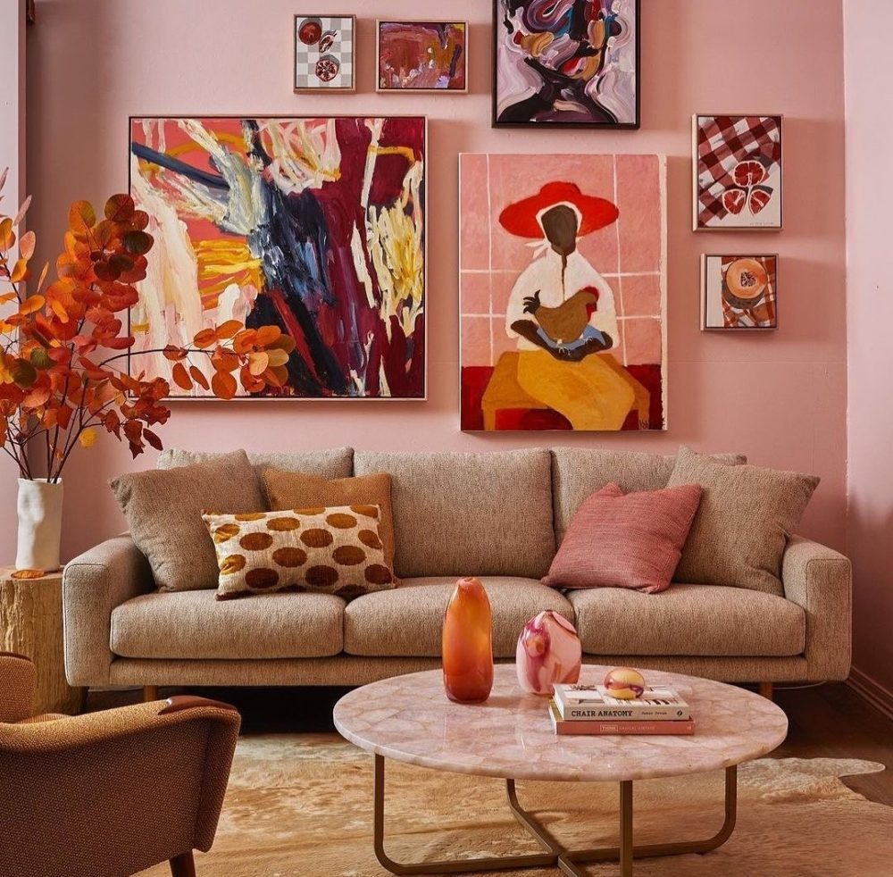 Pink living room with handblown glass pieces on coffee table