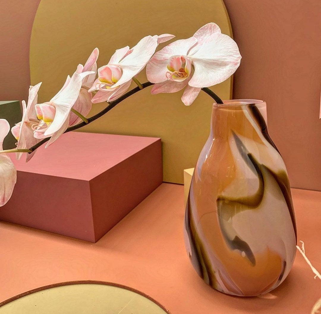 Coloured glass vase with orchids by Amanda Dziedzic