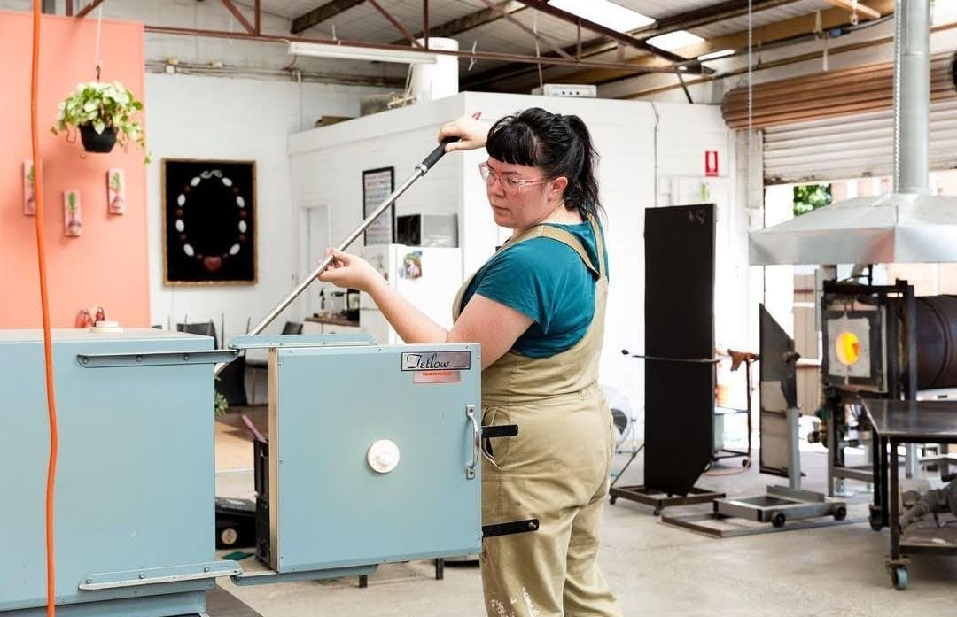 Amanda Dziedzic working in glass blowing studio