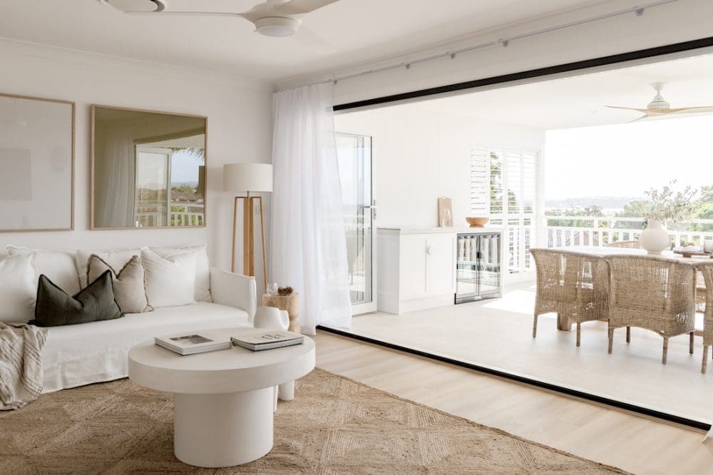 Living room with balcony outdoor entertaining