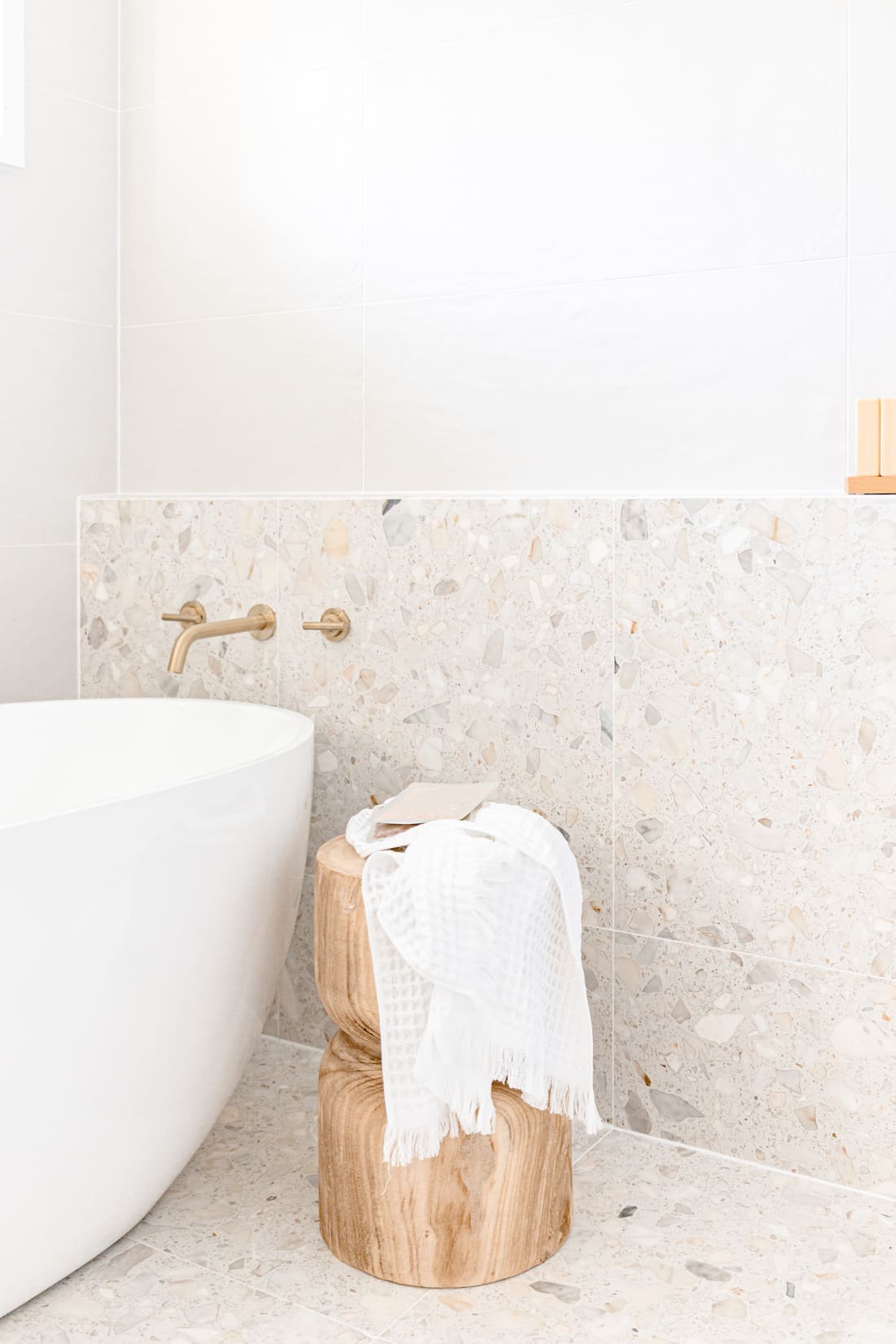 Bathroom with terrazzo wall and floor