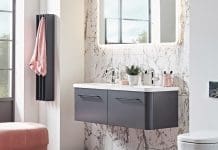 Dark grey Gordon towel warmer in marble bathroom