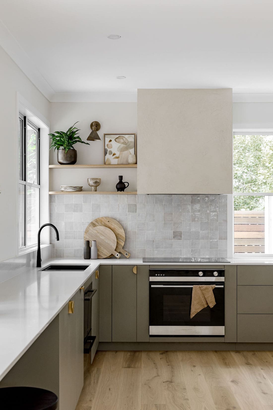 Kitchen with green cabinetry before the renovation