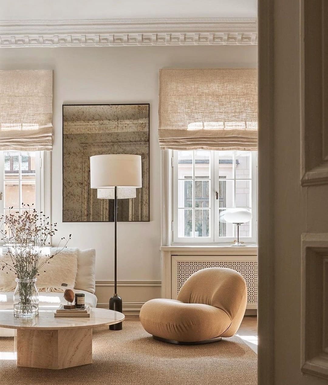 Beige living room with mirror