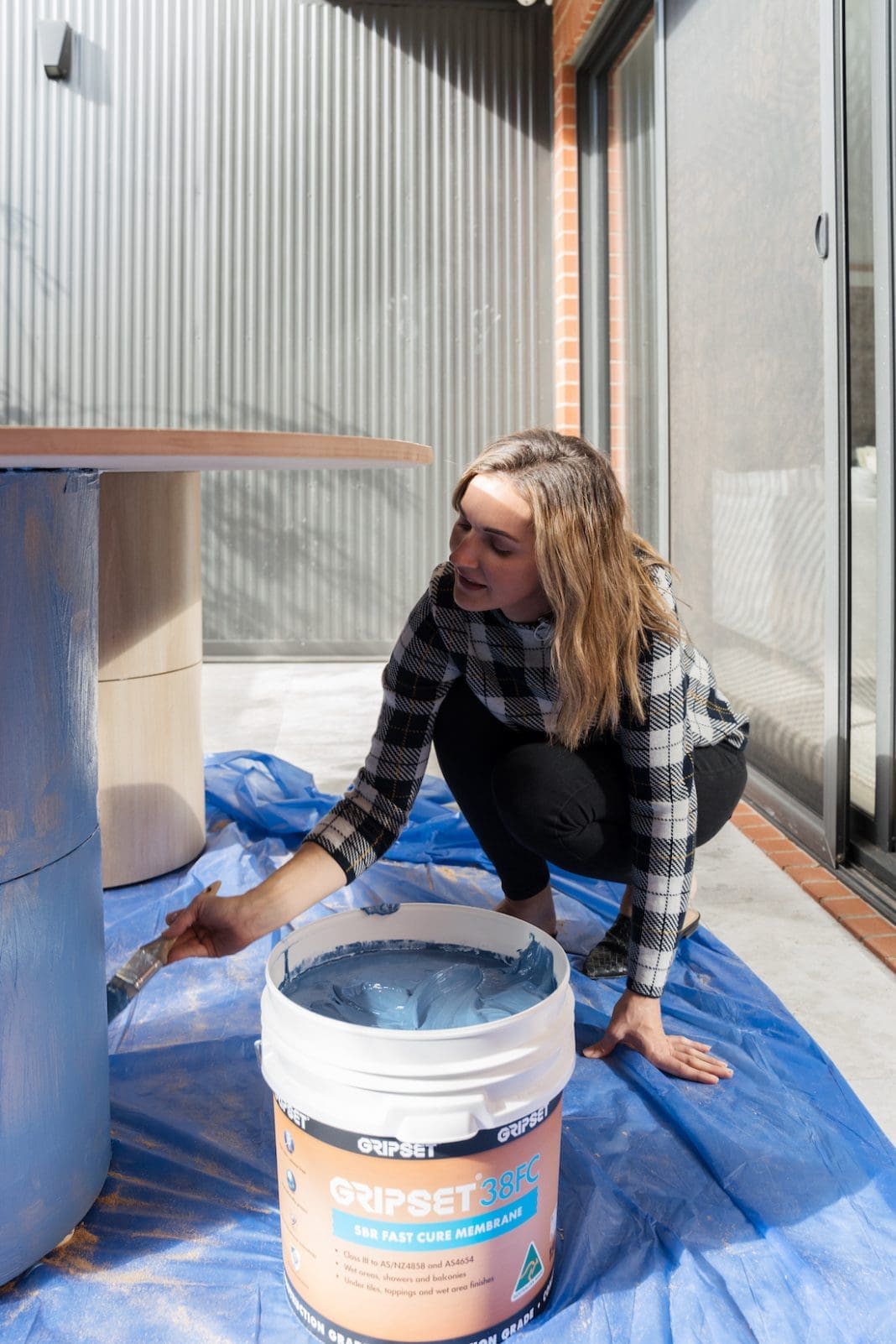 DIY outdoor dining table with tiled pillar legs Style Curator