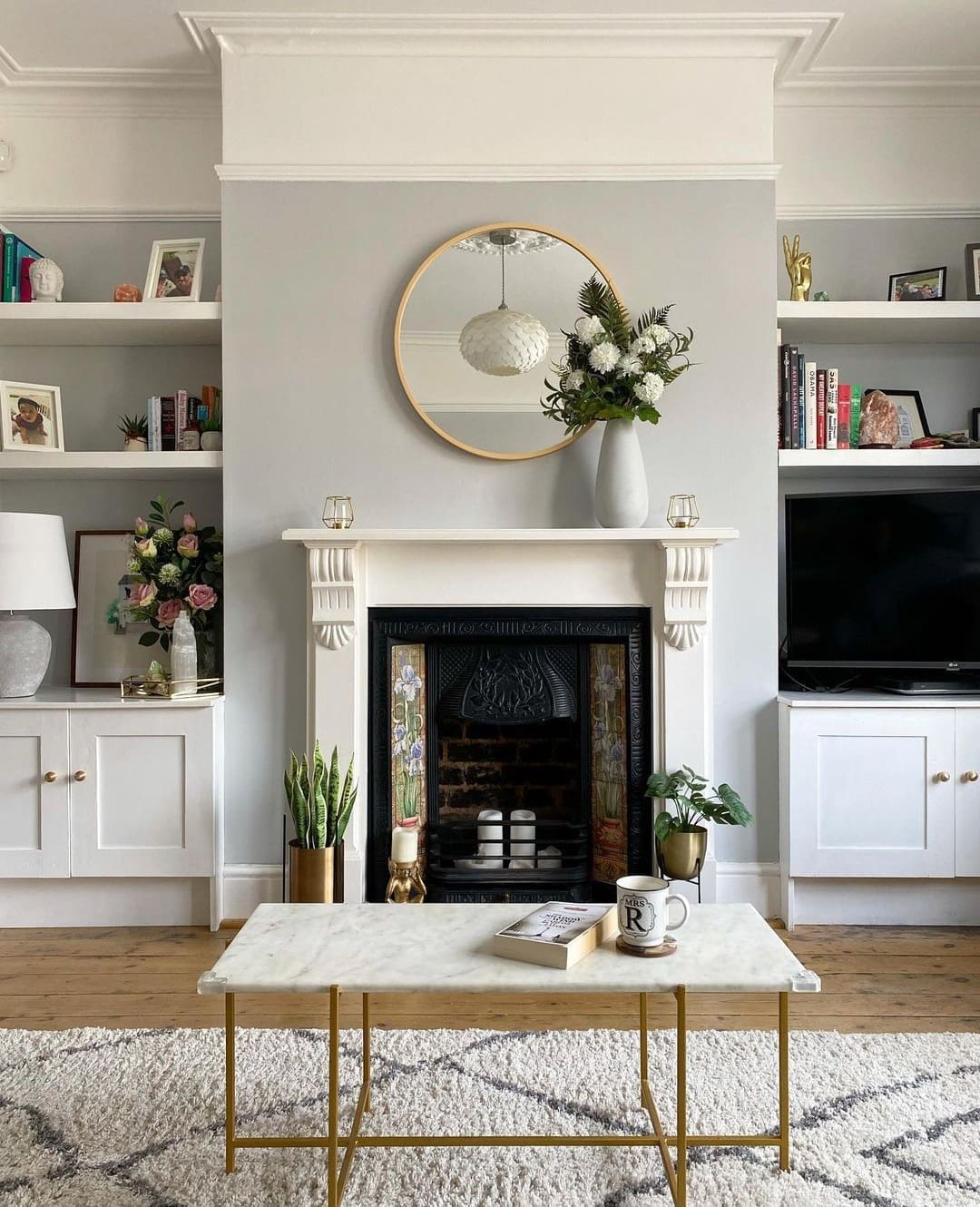 grey living room with victorian fireplace