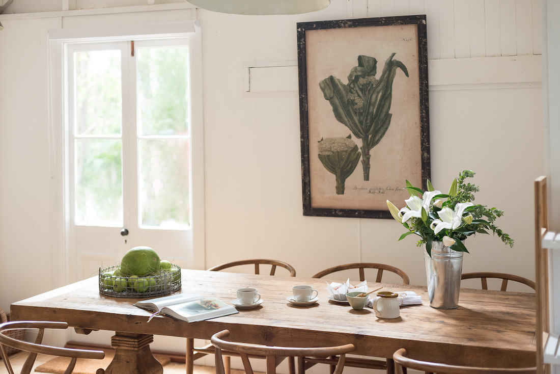 Dining room with vegetable wall print at Fig Tree Villa Byron Bay