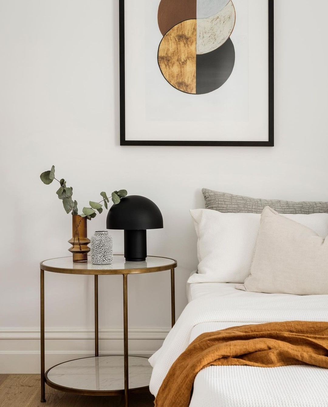 Bedroom with minimal styling and side table vignette