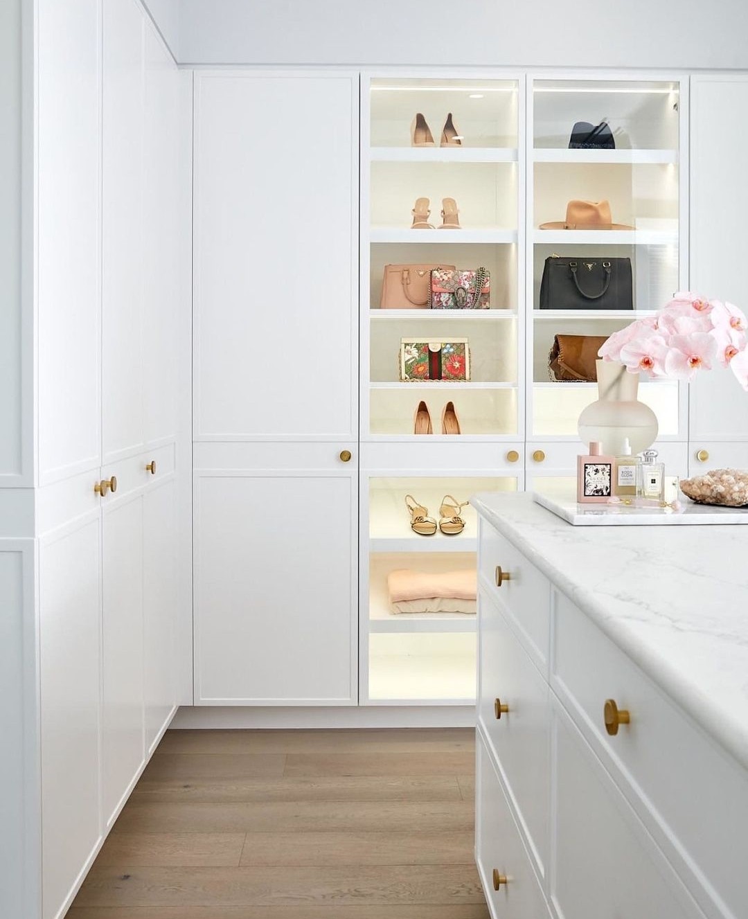 White walk in wardrobe with glass doors from 3 Birds