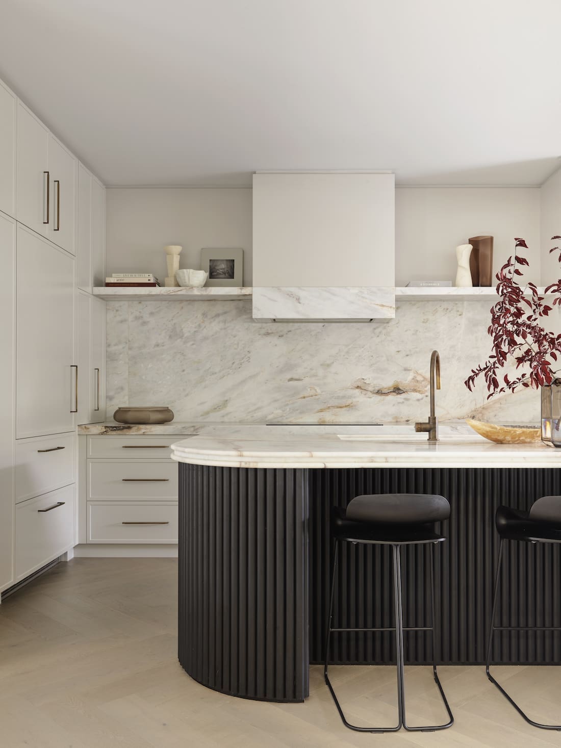 luxe marble kitchen with black bench