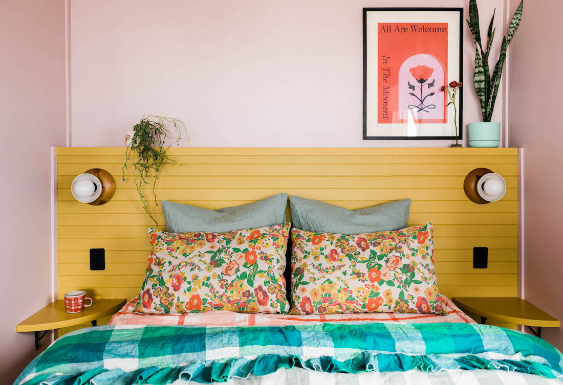 pink bedroom with yellow head board _ pink coastal cabin