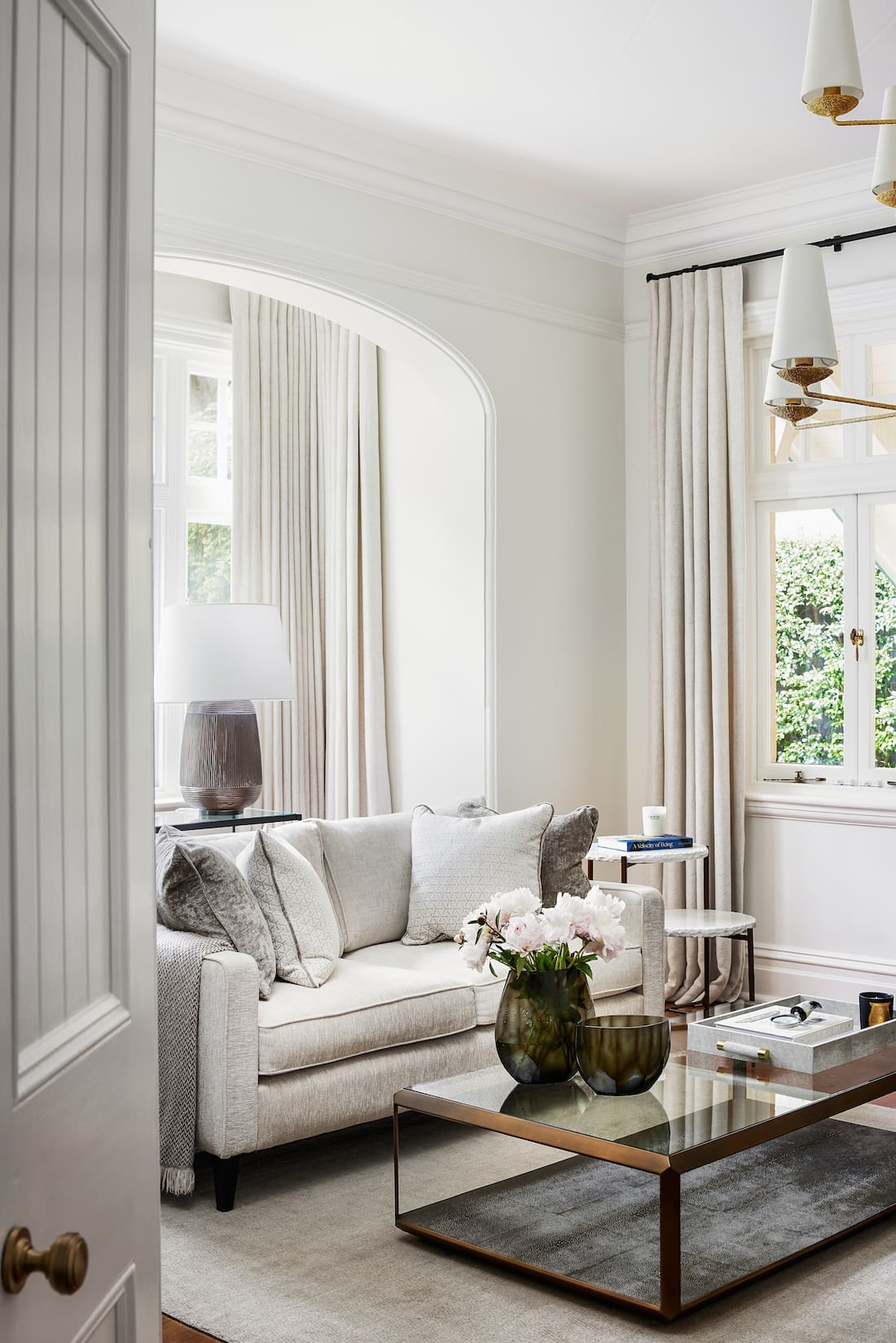 white living room sofa with glass coffee table