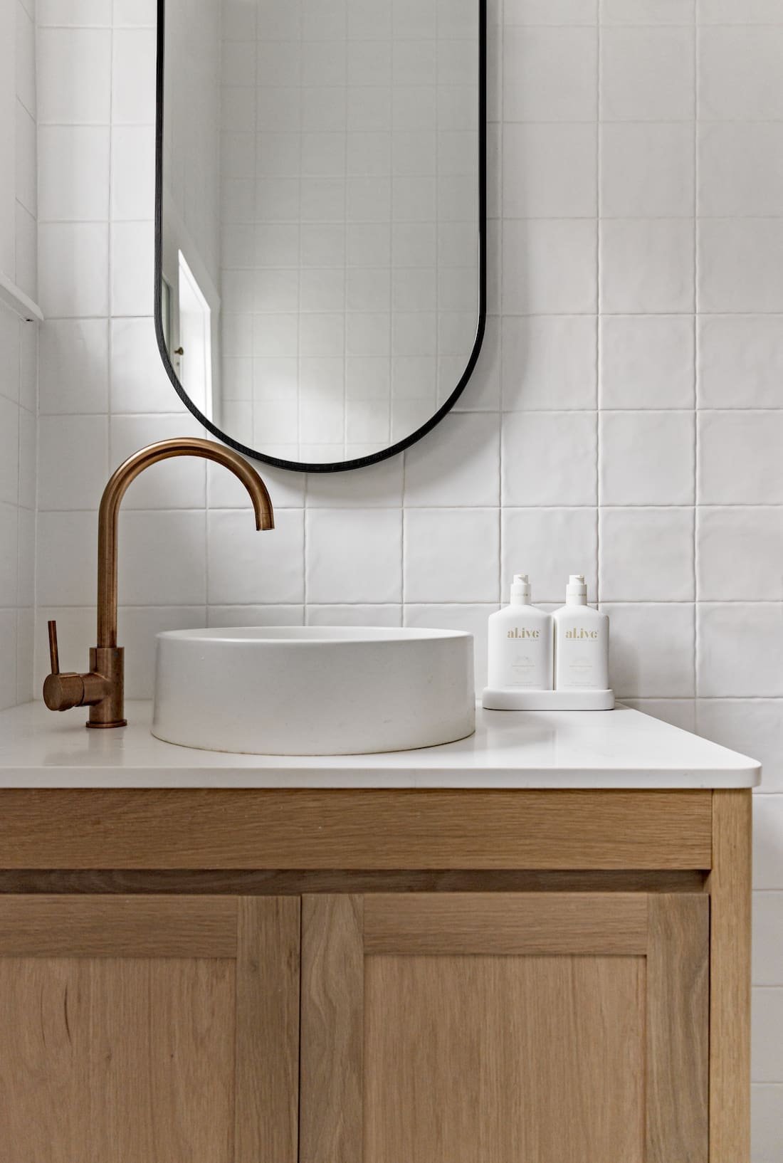 Bathroom with brushed bronze tap