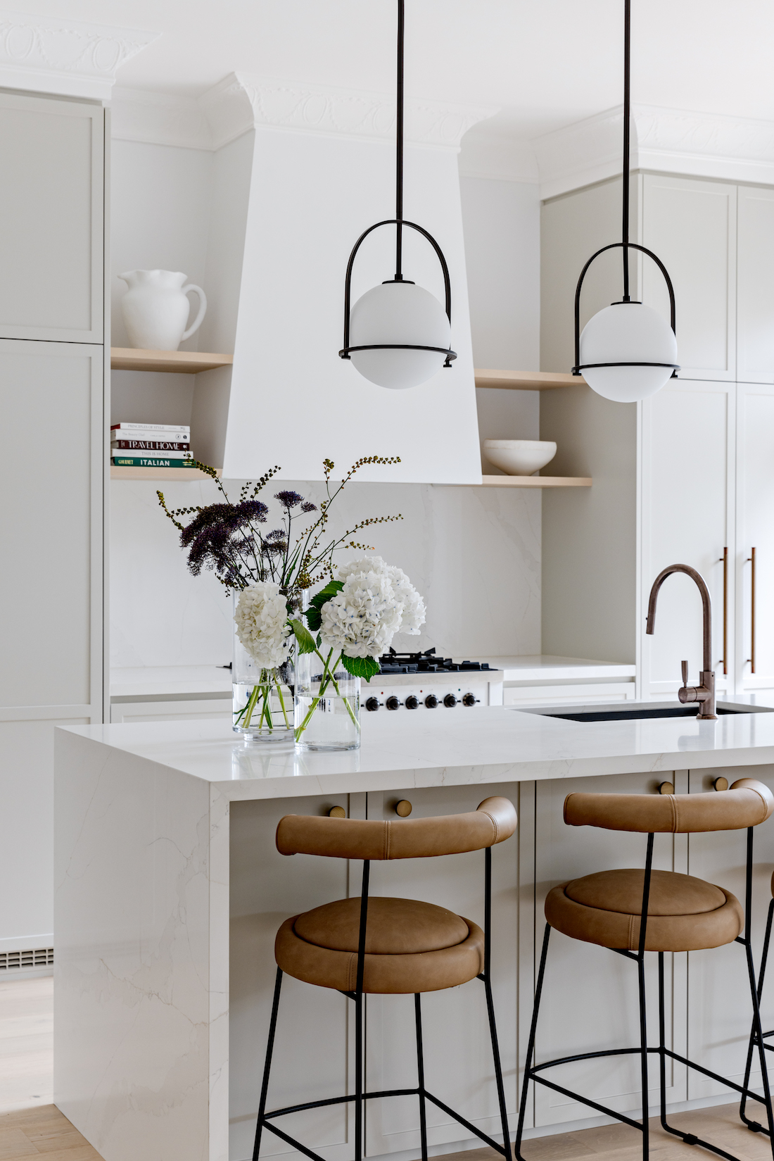 Modern kitchen with brass lights