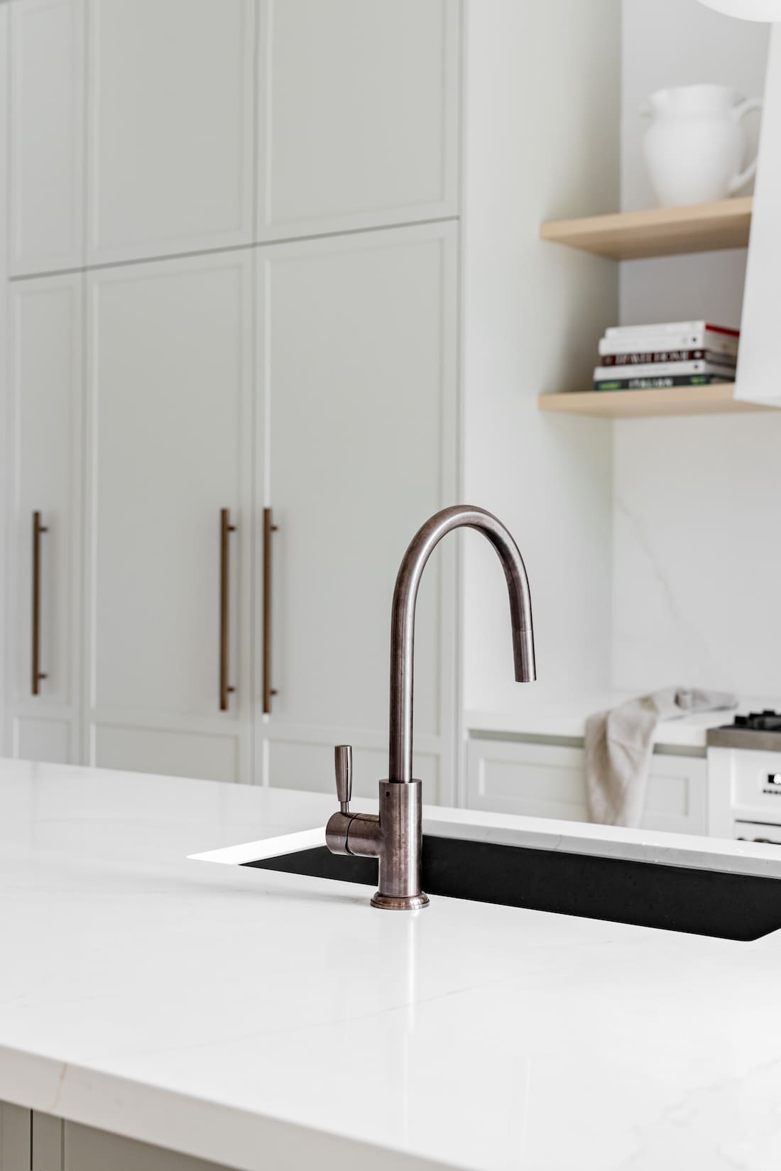 Brushed bronze tap in kitchen