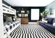 Tribal themed bedroom with bold striped rug