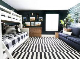 Tribal themed bedroom with bold striped rug