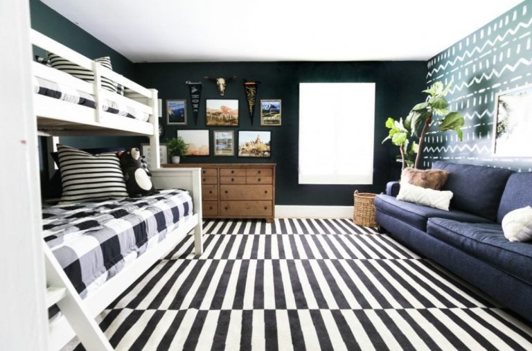 Tribal themed bedroom with bold striped rug