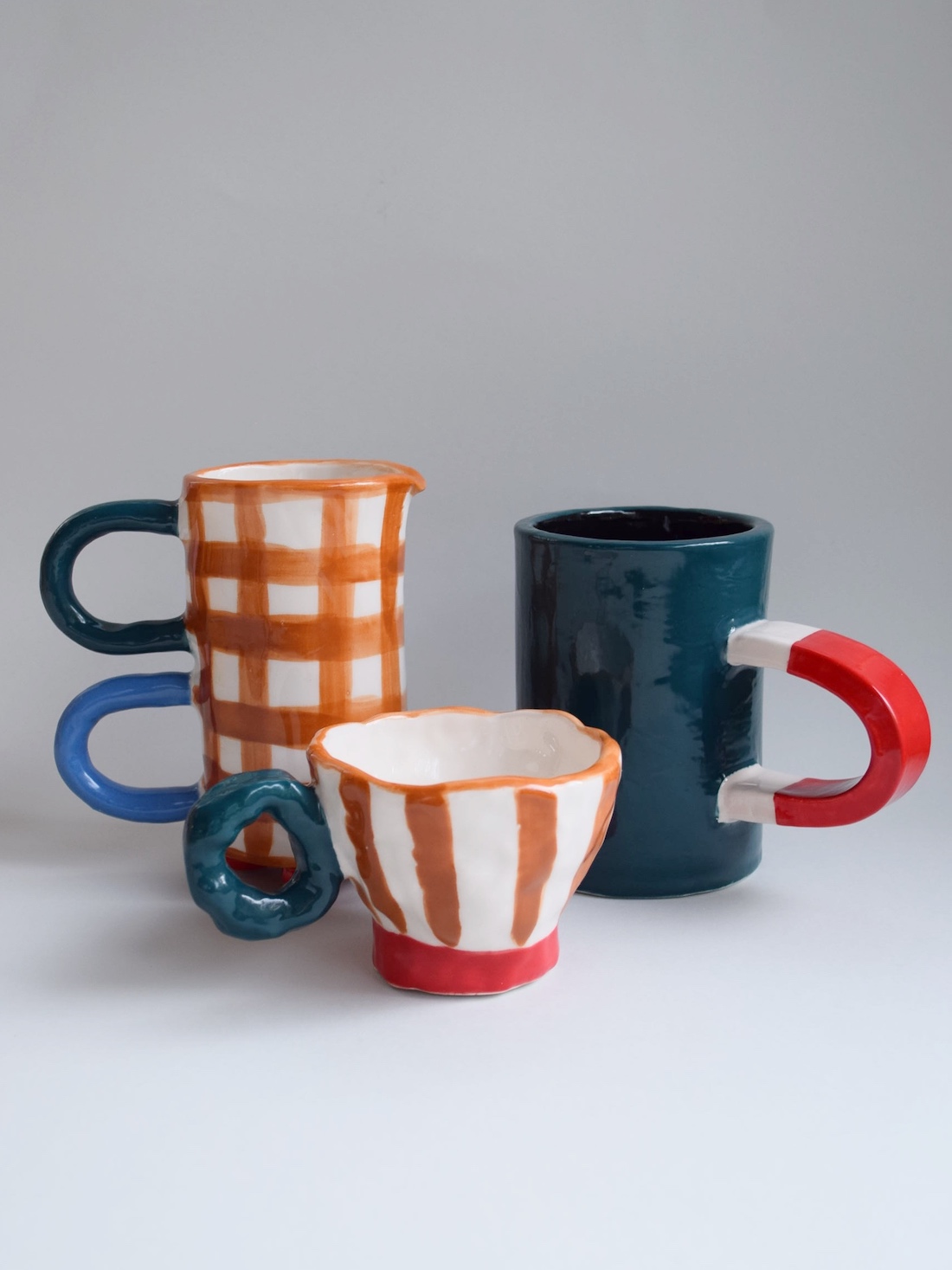 Collection of mugs from Kiwi Poca