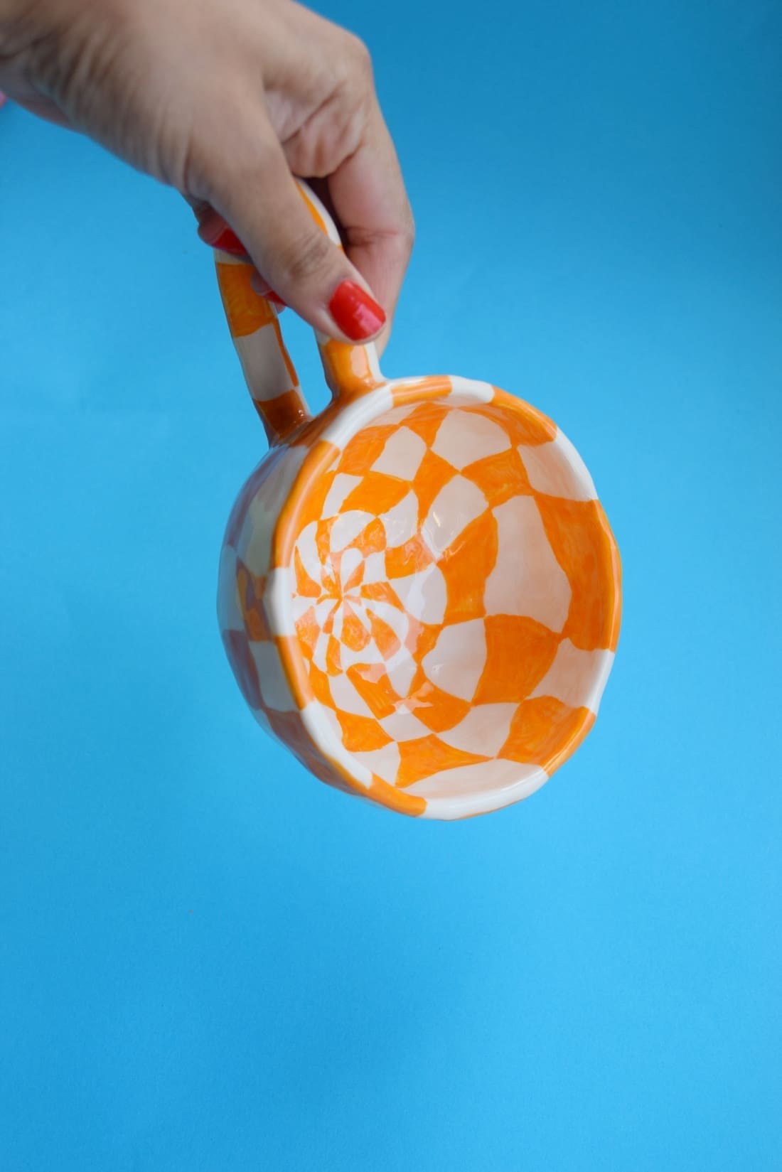 Orange and white checkered mug from Kiwi Poca