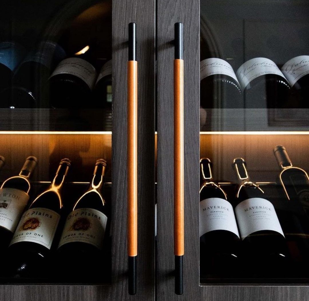 Leather handles on wine cabinet