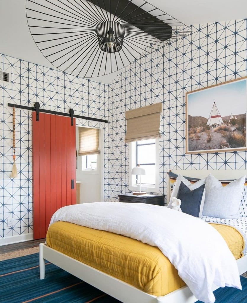 Orange barn door with geometric wallpaper