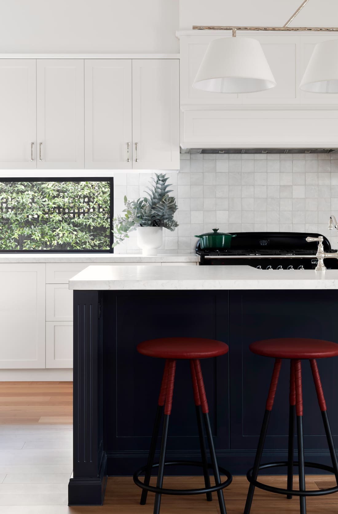 navy blue kitchen bench in white kitchen