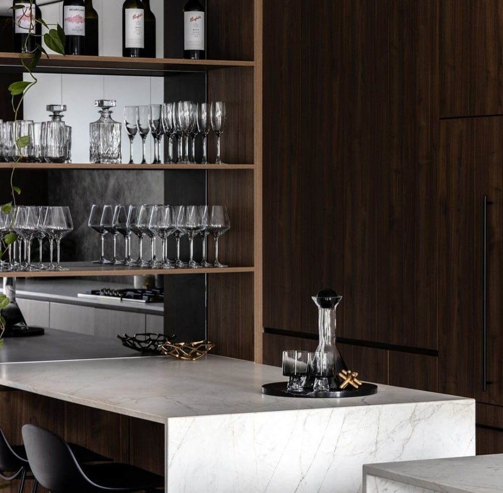 Walnut walls and glass shelves in bar set up