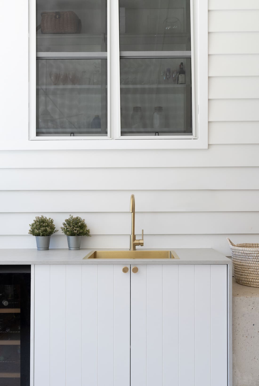 Front Porch Brookfield home - outdoor bar with gold sink