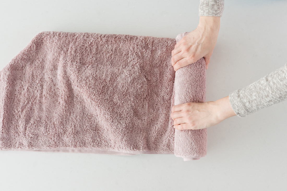 Continue rolling bath towel for this simple towel styling tricks