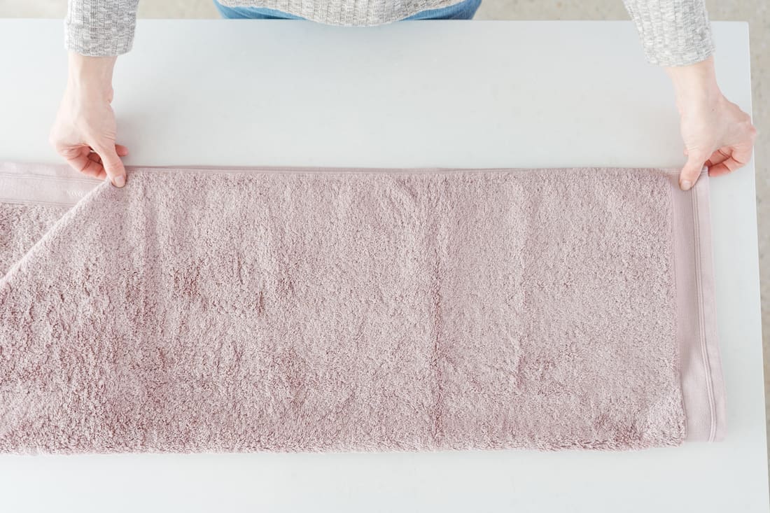 Fold down short edge for this simple towel styling tricks