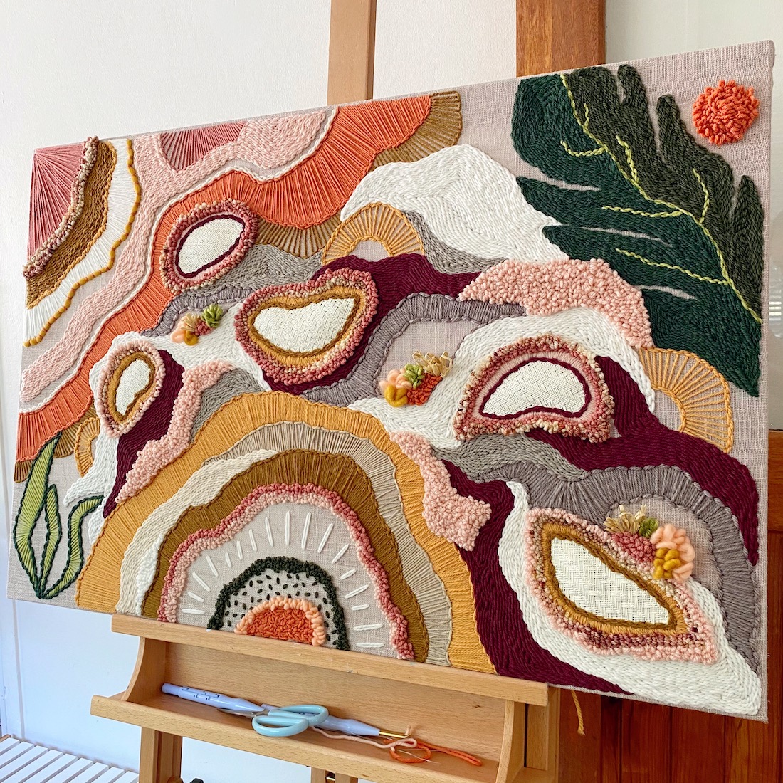 Brown and neutral tapestry art by Pi Williams