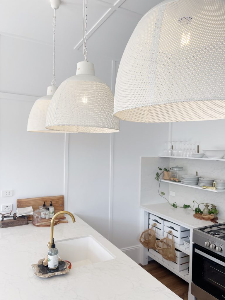 White pendant lights in country cottage