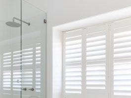 Freestanding bath in white bathroom