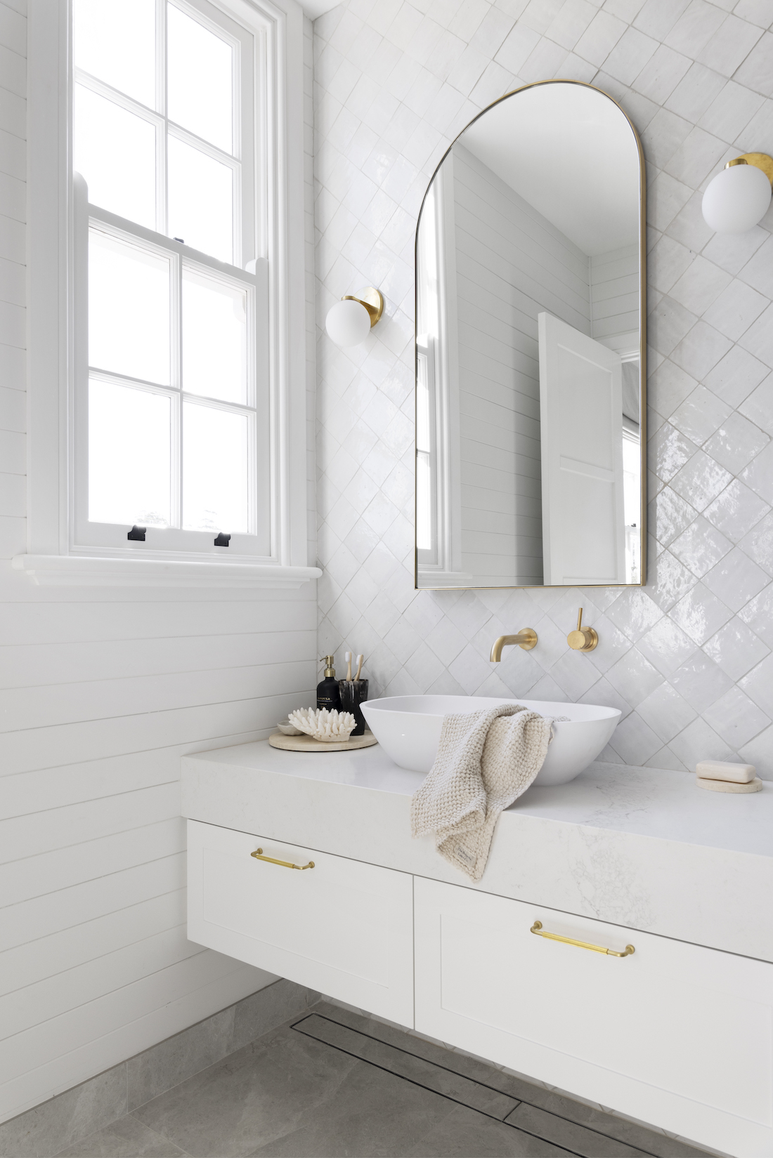 White bathroom with diamond white tiles