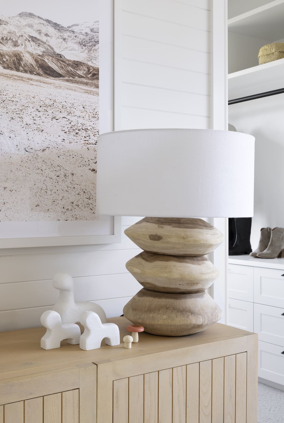 Timber and white lamp on sideboard