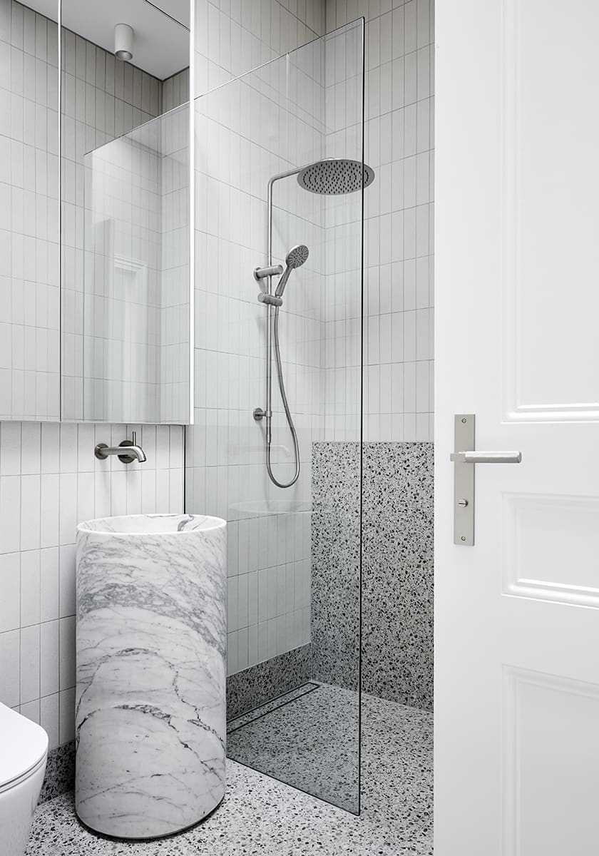 grey terrazzo bathroom with marble sink