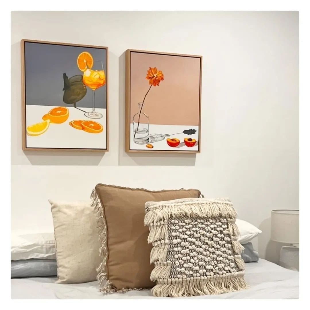 Floral artworks above bed by Jessie Feitosa