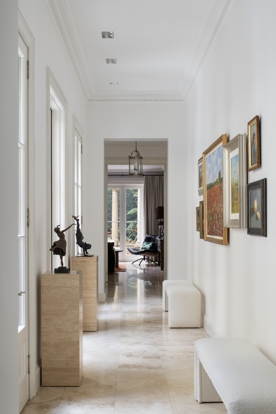 Transcontinental Residence hallway with collection of art
