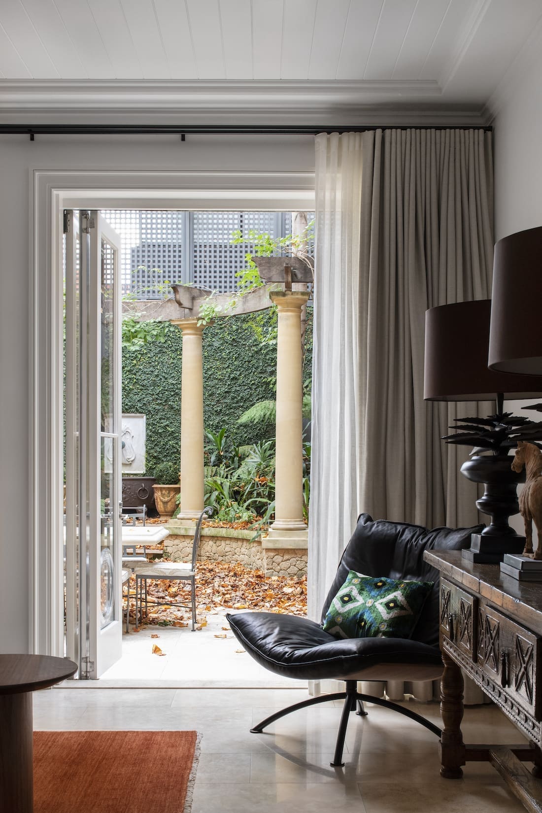 Transcontinental Residence seating nook with view to outdoor courtyard