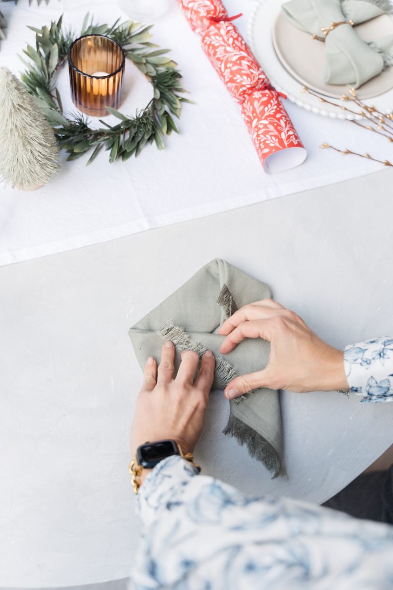 Christmas Napkin Folding Technique Fold Your Napkins Into A Bow   Bow Napkin Folding 768x1152 