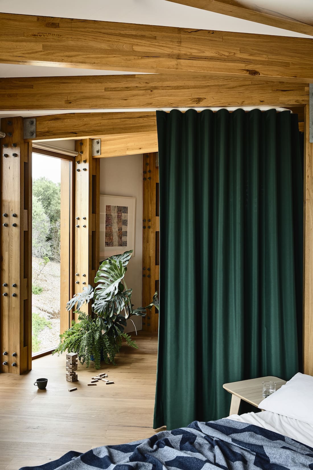 Green curtains separating rooms in round house