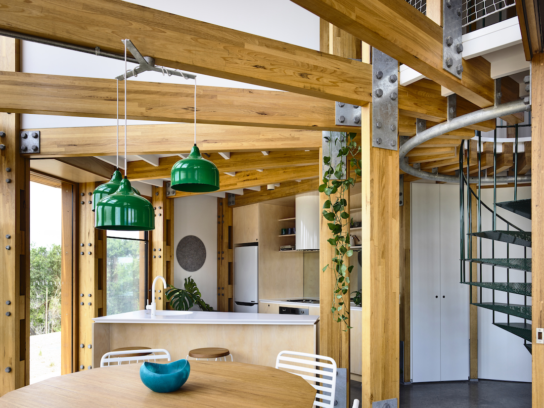 Exposed timber beams and posts in round house