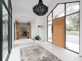 Entry and breezeway with floor runner and beaded light fitting